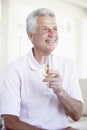 Man Enjoying A Glass Of White Wine Royalty Free Stock Photo