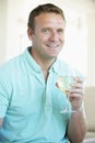 Man Enjoying A Glass Of White Wine Royalty Free Stock Photo