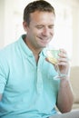 Man Enjoying A Glass Of White Wine Royalty Free Stock Photo