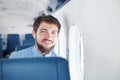 Man enjoying his journey by airplane Royalty Free Stock Photo