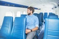 Man enjoying his journey by airplane Royalty Free Stock Photo