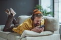 Man enjoying his time at home. The image portrays a sense of relaxation and tranquility as the man engages in various