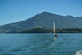 Man enjoying his time on small sailboat on Lake Lucerne close to Kussnacht am Rigi in Switzerland