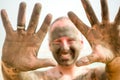 Man enjoying mud from Dead Sea, Israel Royalty Free Stock Photo