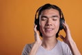 Man enjoying music in headphones with satisfied facial expression Royalty Free Stock Photo