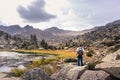 Man enjoying a natural mountain landscape in the Pyrenees, Andorra, Estany Pessons