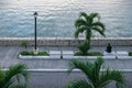 Man enjoying sunset at the promenade along lake Itza in Flores, Peten, Guatemala