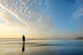 Man enjoying time on beach at sunrise. Royalty Free Stock Photo