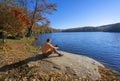 Man enjoying time relaxing by the beautiful lake.