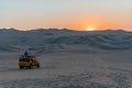 Man enjoying the view of sunset on dune buggy Peru South America Royalty Free Stock Photo