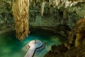 Man enjoying the view of Suytun Cenote from the top Yucatan Mexico North America