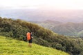 Man enjoying the view of the Valley. Man hiking at mountains with heavy backpack Travel Lifestyle wanderlust adventure concept sum Royalty Free Stock Photo