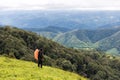 Man enjoying the view of the Valley. Man hiking at mountains with heavy backpack Travel Lifestyle wanderlust adventure concept sum Royalty Free Stock Photo