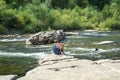 Man Enjoys the view over the River Ardeche along the old village