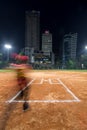 Man entering softball diamond in long exposure