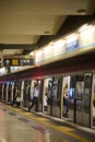 Man entering an underground train in old Hung Hom station in Hong Kong Royalty Free Stock Photo