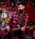 Man with enthusiastic face holds guitar, play music, Royalty Free Stock Photo