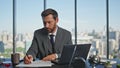 Man entrepreneur writing papers in contemporary office. Successful boss signing Royalty Free Stock Photo