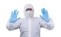 Man epidemiologist in coverall disposable anti-epidemic antibacterial isolation suit shows a prohibitory gesture