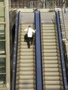 Man on escalator Royalty Free Stock Photo