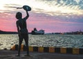 Man escorts ship in port