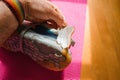 Man Examining a Damaged Luxury Running Shoe