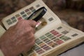 Man Examining An Old Stamp Book Royalty Free Stock Photo