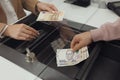 Man exchanging money at cash department window, closeup Royalty Free Stock Photo