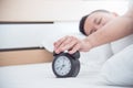 Man exclude the alarm clock in the morning. Royalty Free Stock Photo