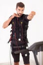 Man exercise on electro muscular stimulation machine Royalty Free Stock Photo