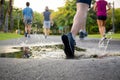 Man exercise running through puddle splashing his shoes. Royalty Free Stock Photo