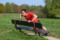 Man Exercising doing PressUps on a Park Bench Royalty Free Stock Photo