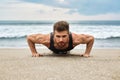 Man Exercising, Doing Push Up Exercises On Beach. Fitness Workout