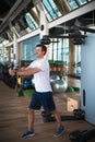 Man exercising in the gym on a pec deck machine for chest workout Royalty Free Stock Photo