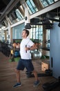 Man exercising in the gym on a pec deck machine for chest workout Royalty Free Stock Photo