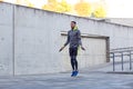 Man exercising with jump-rope outdoors Royalty Free Stock Photo