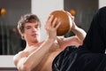 Man is exercising with medicine ball in gym Royalty Free Stock Photo