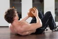 Man is exercising with medicine ball in gym Royalty Free Stock Photo