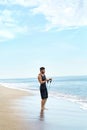 Man Exercising Outdoor, Doing Workout Exercise At Beach. Fitness Royalty Free Stock Photo