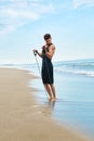 Man Exercising Outdoor, Doing Workout Exercise At Beach. Fitness Royalty Free Stock Photo