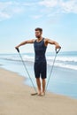 Man Exercising Outdoor, Doing Workout Exercise At Beach. Fitness Royalty Free Stock Photo