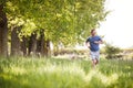 Man Exercising Running Through Countryside Field