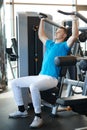 Man exercising on a simulator for dorsi