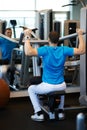 Man exercising on a simulator for dorsi