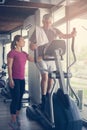 Man exercising on stationary bikes in fitness class. Man Royalty Free Stock Photo