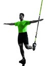 Man exercising suspension training trx silhouette Royalty Free Stock Photo