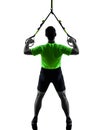 Man exercising suspension training trx silhouette Royalty Free Stock Photo