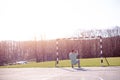 Man exercising with suspensions in park