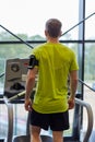 Man exercising on treadmill in gym from back Royalty Free Stock Photo