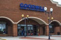 Man exits the Goodwill store wearing a face shield Royalty Free Stock Photo